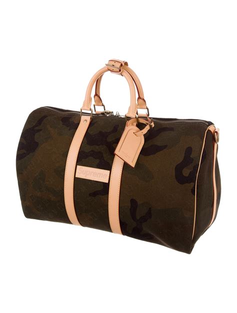 louis vuitton x supreme keepall bandouliere monogram camo 45 camo|Louis Vuitton x Supreme Monogram Camouflage Keepall .